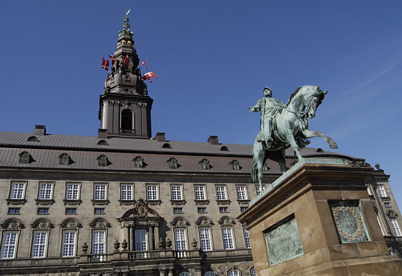 Danish flags/dannebrog flys over chriostians parliament beacuse of danish constitutional day